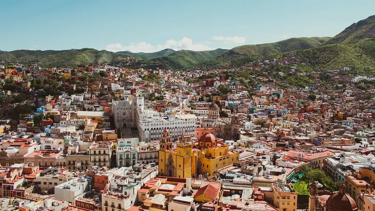 Colorful colonial buildings in a Mexican city with cobblestone streets